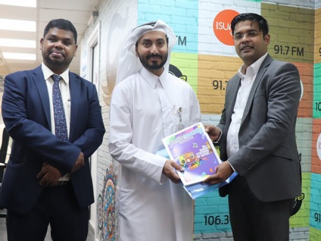 Ameer Ali Handing over the Annual Newsletter to Mr. Mohamed Hassan Al-Nuaimi