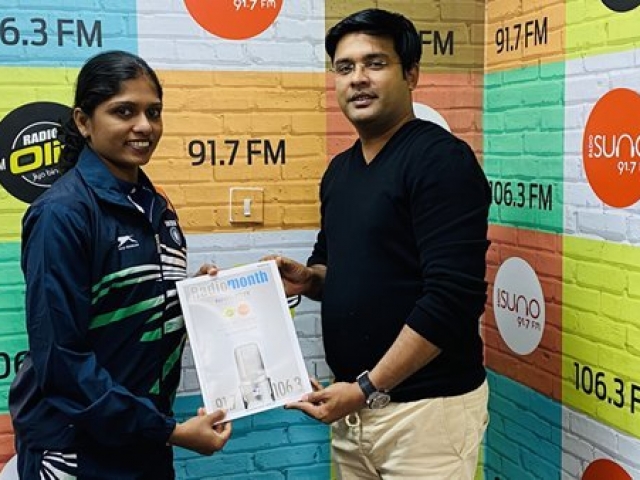 Radio Suno 91.7 FM Managing Director Mr. Ameer Ali Paruvally Handing Over Radio Olive and Radio Suno Annual Newsletter to Ms Tintu Lukka, The Indian Olympian Star who represented India in the 2012 and 2016 World Olympics, during her studio visit to celebrate the Qatar National Sports Day 2020.