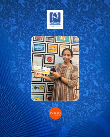 A smiling winner holding a Parthas gift card